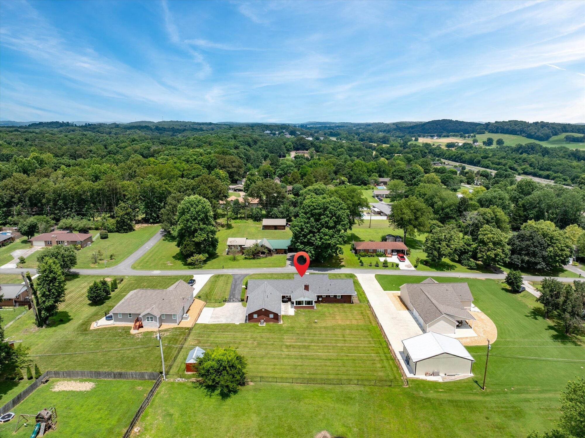 137 County Road 146 Riceville, TN 37370 - Photo 54 of 58 an aerial view of a house with a garden