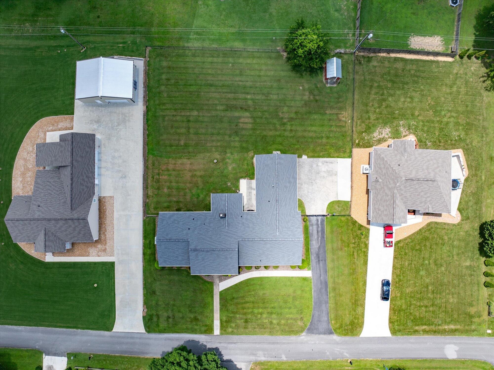 137 County Road 146 Riceville, TN 37370 - Photo 58 of 58 an aerial view of a house with a garden and plants