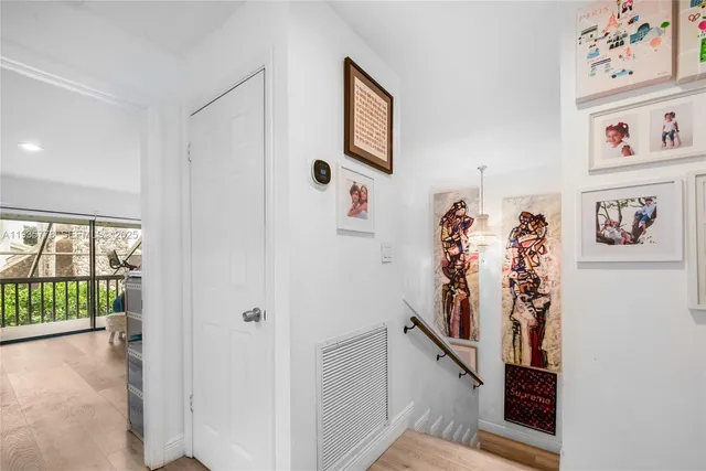 a view of a hallway with workspace