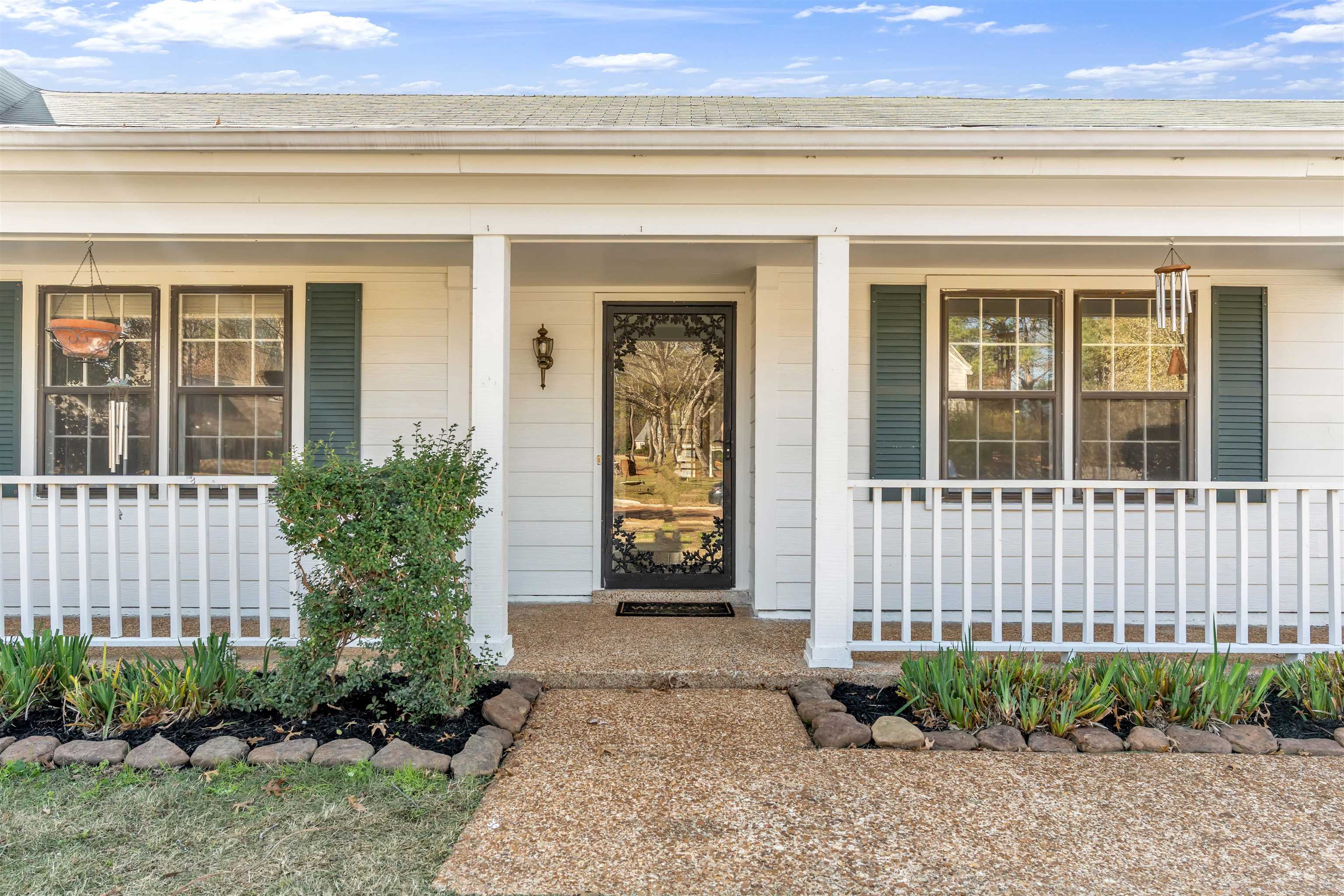 301 East Harpers Ferry Road Collierville, TN 38017 - Photo 2 of 39 View of exterior entry with a porch and a shingled roof