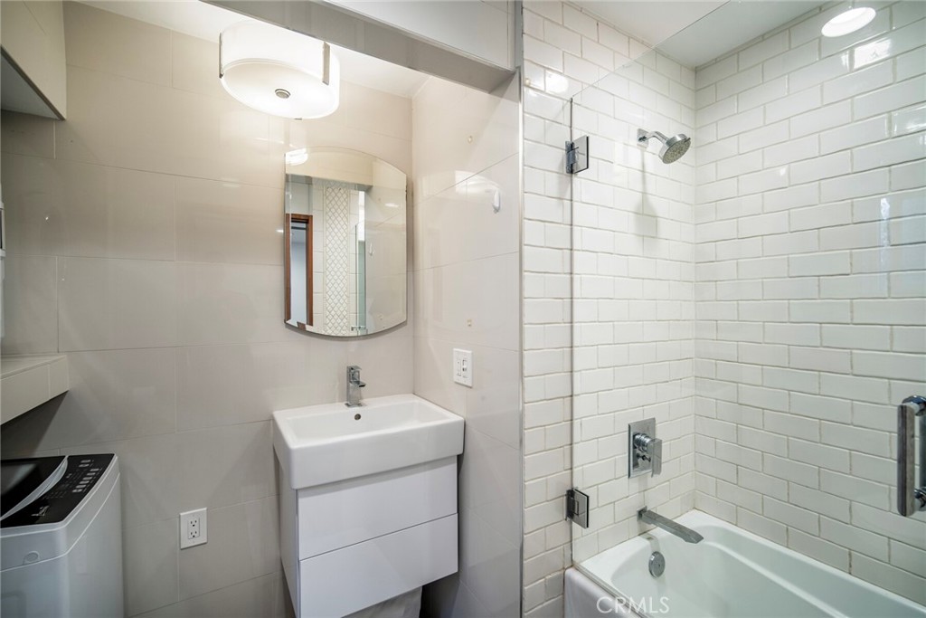 33915 Robles Drive, Unit B Dana Point, CA 92629 - Photo 11 of 22 a bathroom with a sink a toilet and shower