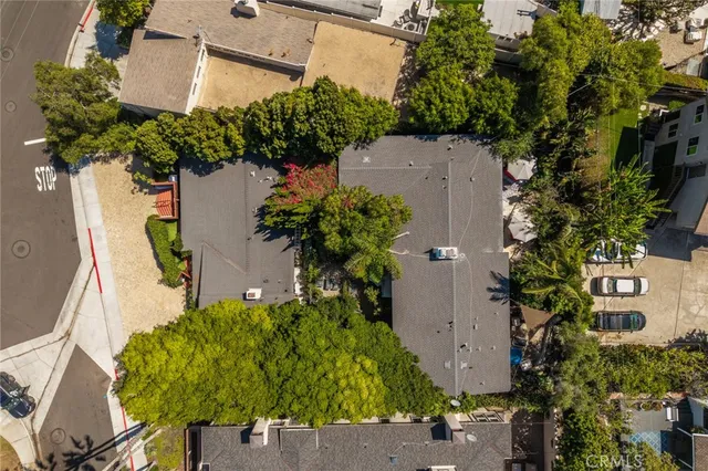 an aerial view of a house with a yard basket ball court and a fountain