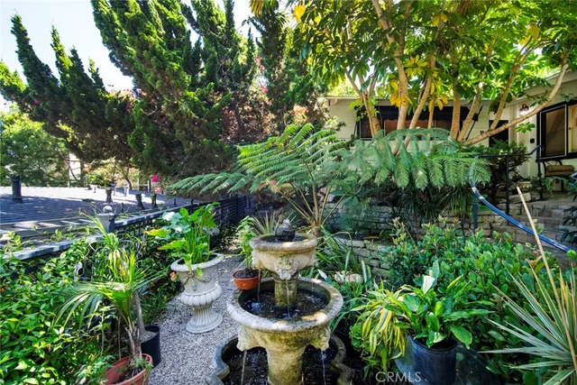 a view of a chair and table in a garden