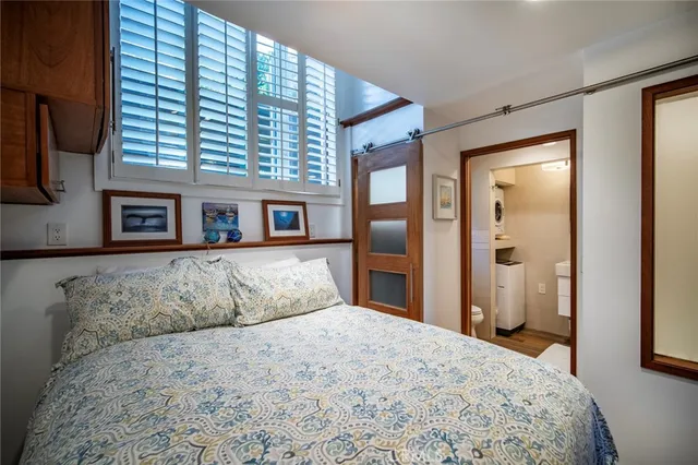 a bedroom with a large bed and a dresser