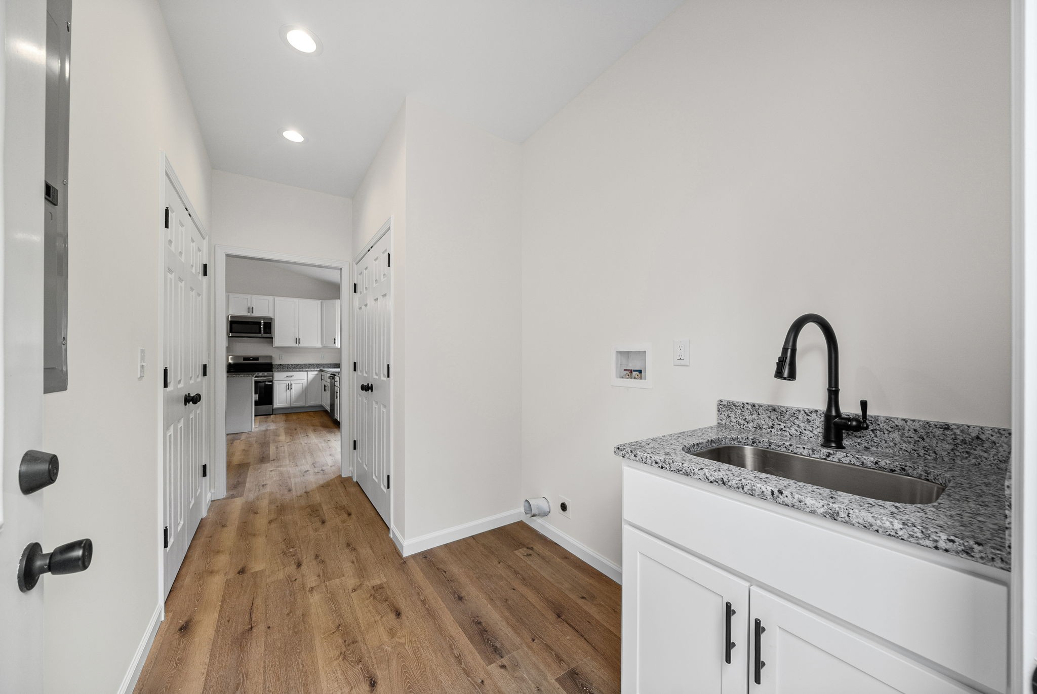 690 Brazzle Road Waverly, TN 37185 - Photo 27 of 35 a kitchen with a sink and refrigerator