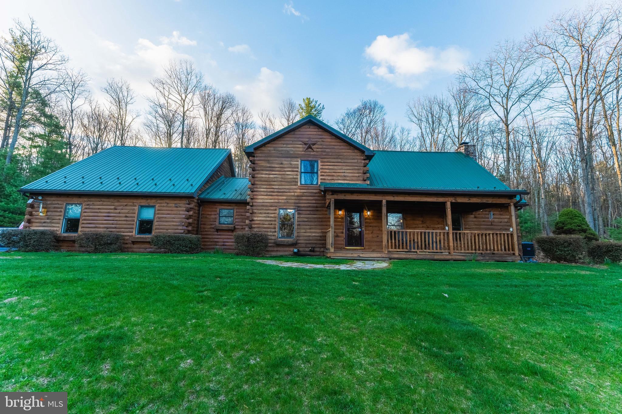 9 Irish Road New Bloomfield, PA 17068 - Photo 9 of 48 a front view of a house with garden