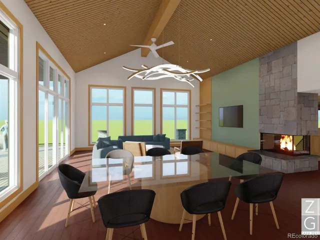 a dining room with furniture a large window and a chandelier