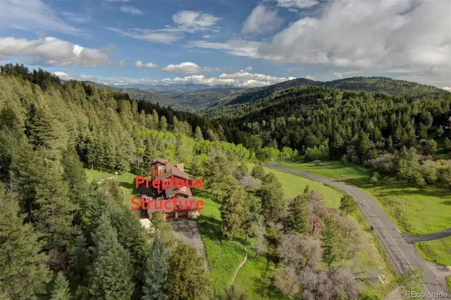 a view of a garden with an outdoor seating