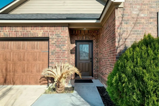 a front view of a house with outdoor seating