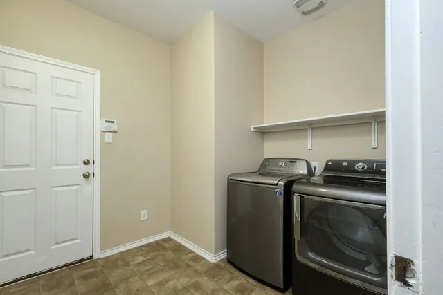 a utility room with washer and dryer