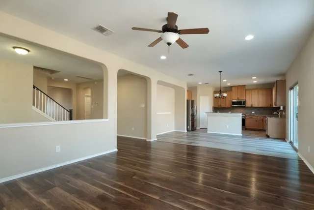 a view of kitchen with cabinets and wooden floor