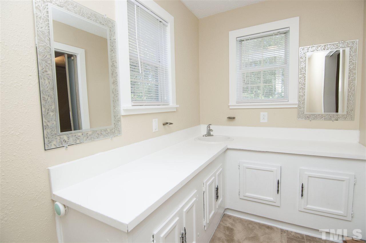 436 Raleigh View Road Raleigh, NC 27610 - Photo 14 of 25 a bathroom with a sink and a bathtub
