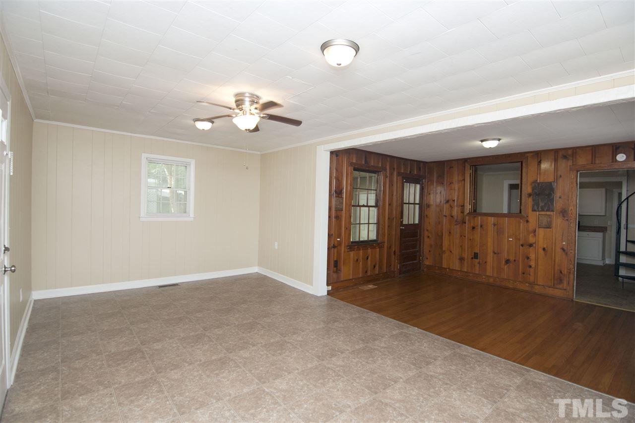 436 Raleigh View Road Raleigh, NC 27610 - Photo 8 of 25 wooden floor in an empty room with a ceiling fan