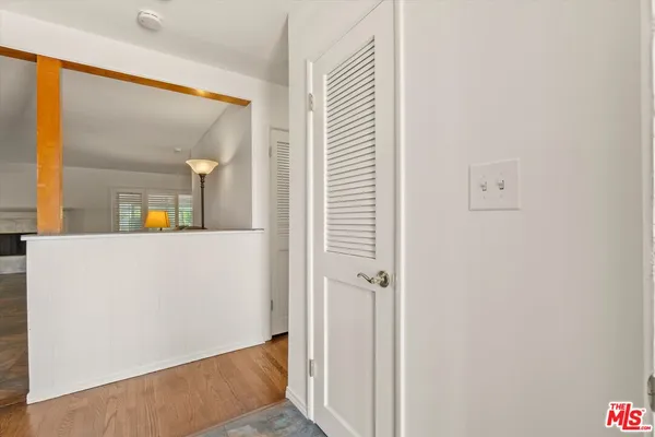 a view of a bathroom from a hallway