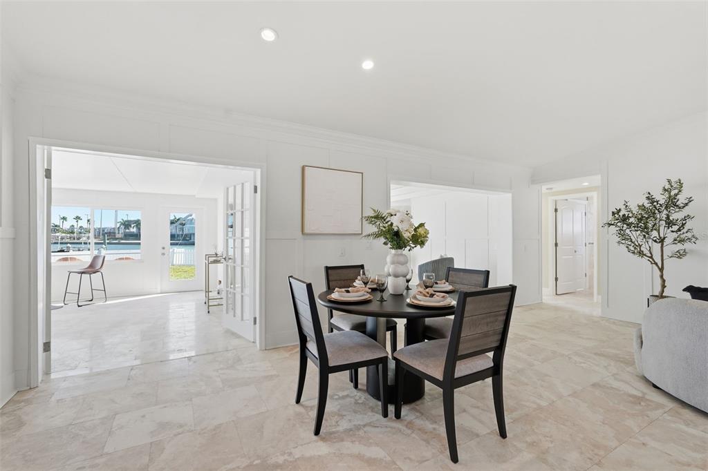 15302 Harbor Drive Madeira Beach, FL 33708 - Photo 12 of 47 a view of a dining room with furniture and wooden floor