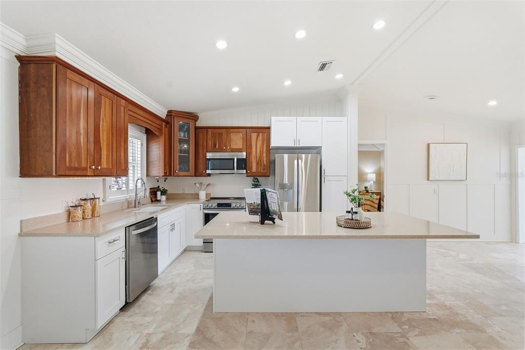 15302 Harbor Drive Madeira Beach, FL 33708 - Photo 14 of 47 a large white kitchen with cabinets and a large window