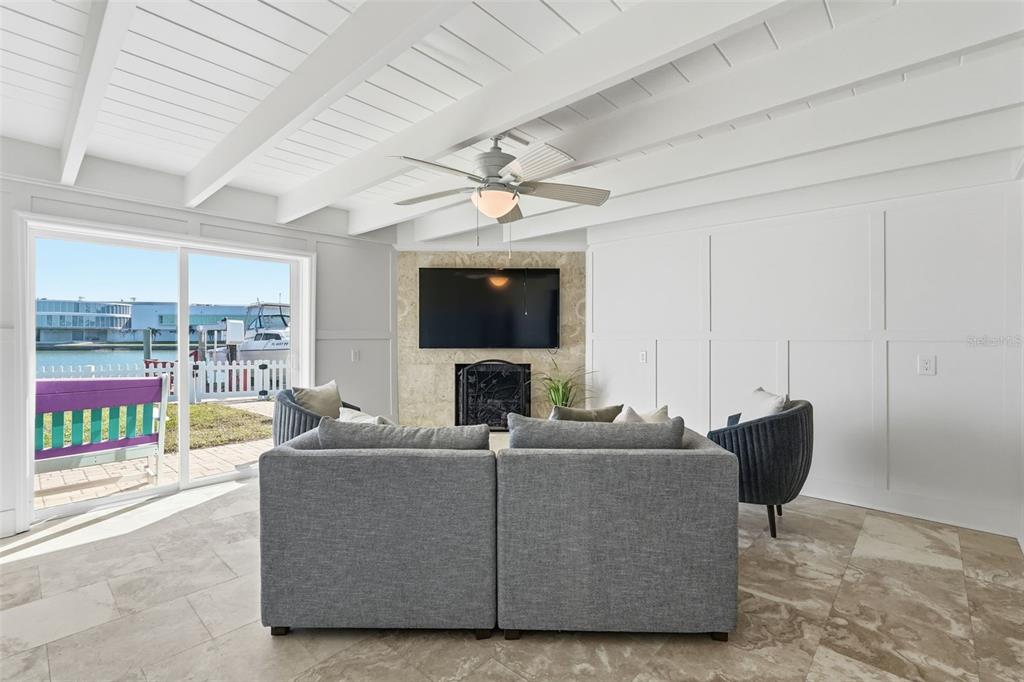 15302 Harbor Drive Madeira Beach, FL 33708 - Photo 19 of 47 a living room with furniture and a flat screen tv