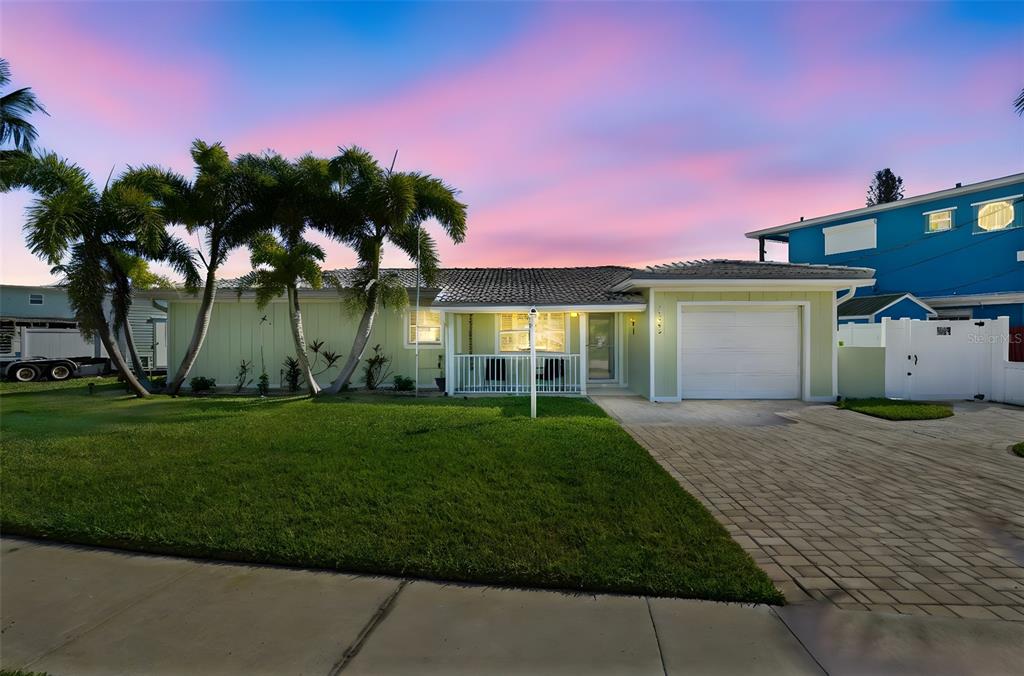 15302 Harbor Drive Madeira Beach, FL 33708 - Photo 2 of 47 a view of a yard in front of house