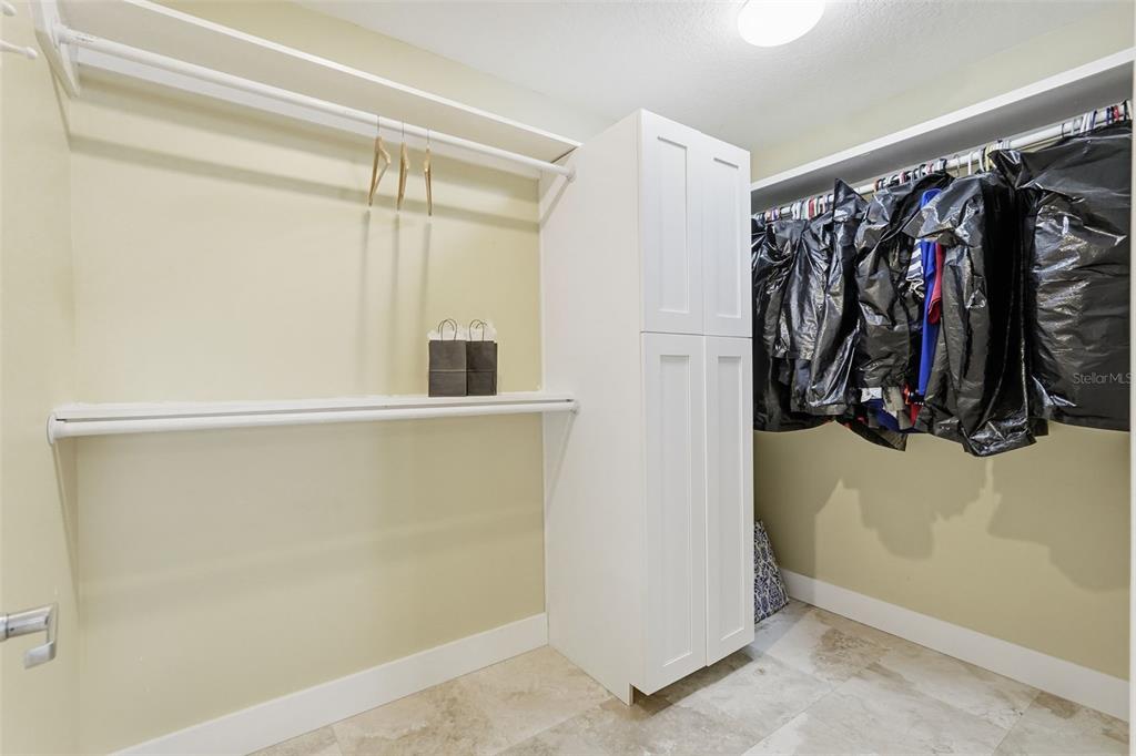 15302 Harbor Drive Madeira Beach, FL 33708 - Photo 25 of 47 a view of walk in closet with clothes