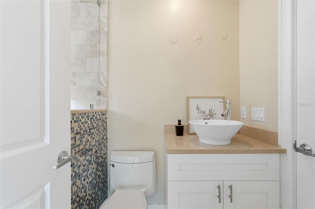 15302 Harbor Drive Madeira Beach, FL 33708 - Photo 29 of 47 a bathroom with a sink toilet and shower