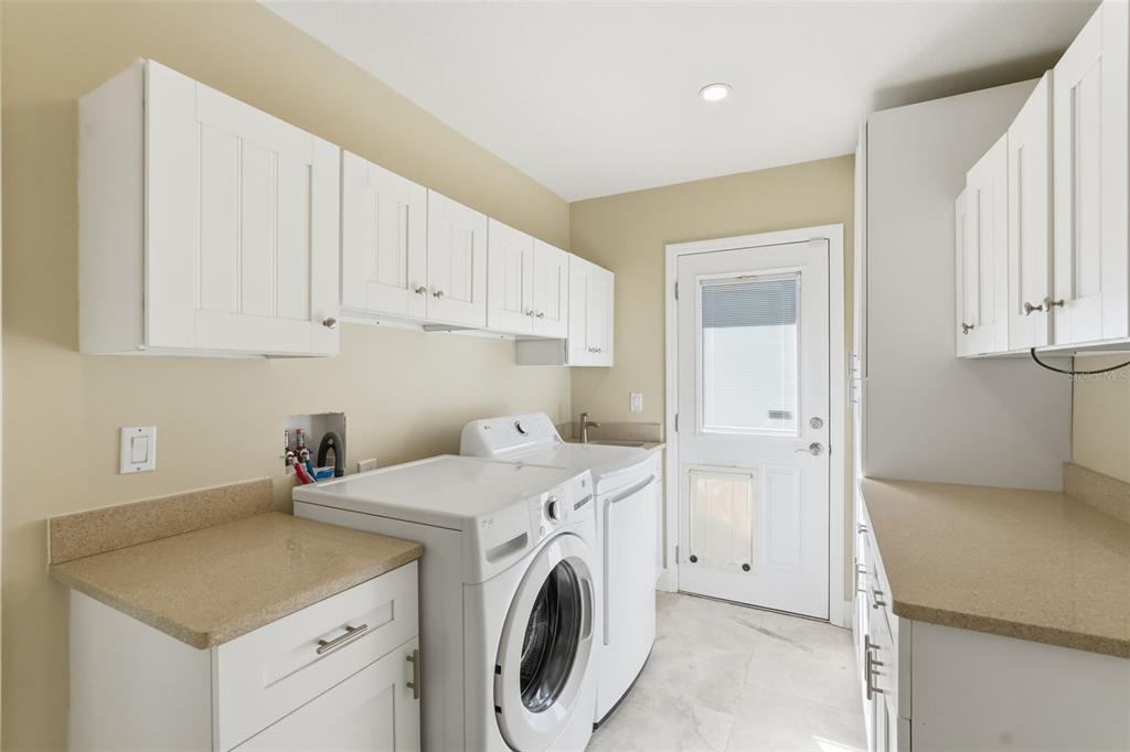 15302 Harbor Drive Madeira Beach, FL 33708 - Photo 30 of 47 a utility room with dryer and washer