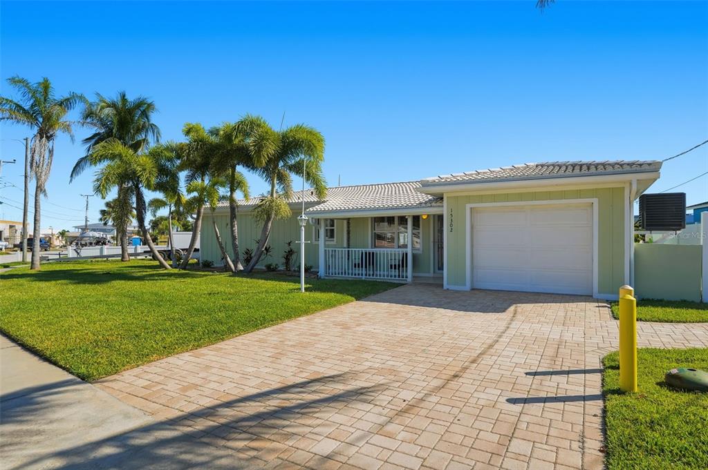 15302 Harbor Drive Madeira Beach, FL 33708 - Photo 3 of 47 a view of a house with a garden