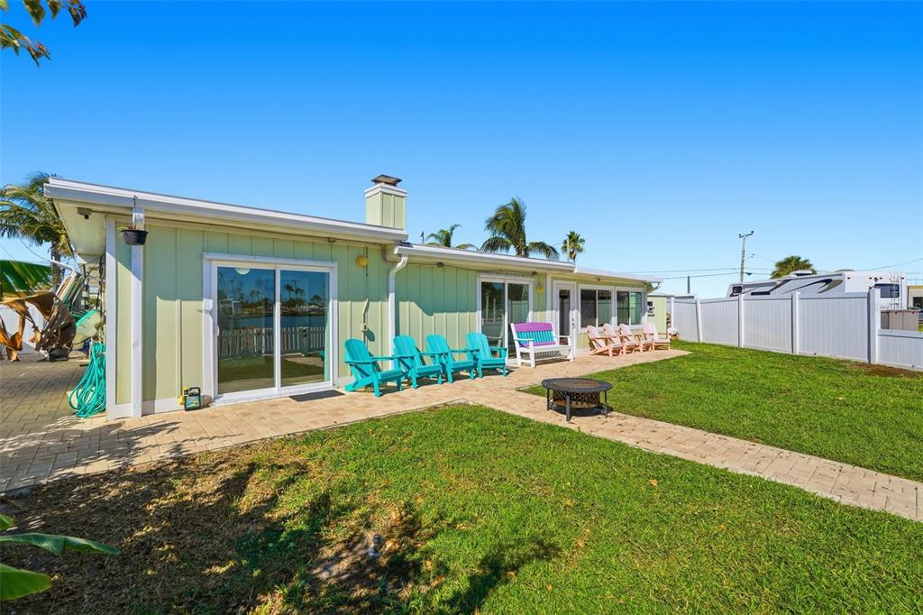 15302 Harbor Drive Madeira Beach, FL 33708 - Photo 36 of 47 a front view of a house with a yard and porch