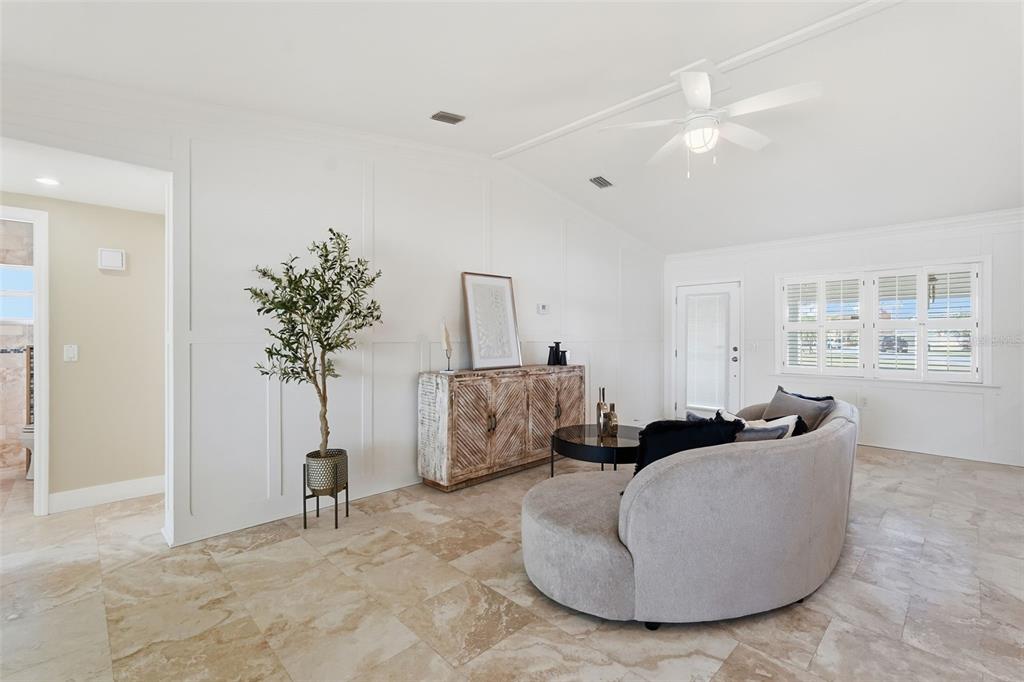 15302 Harbor Drive Madeira Beach, FL 33708 - Photo 9 of 47 a living room with furniture and a potted plant