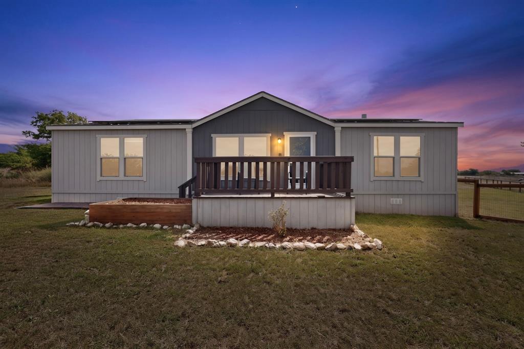 115 Vinall Circle Decatur, TX 76234 - Photo 2 of 23 a front view of a house with a yard