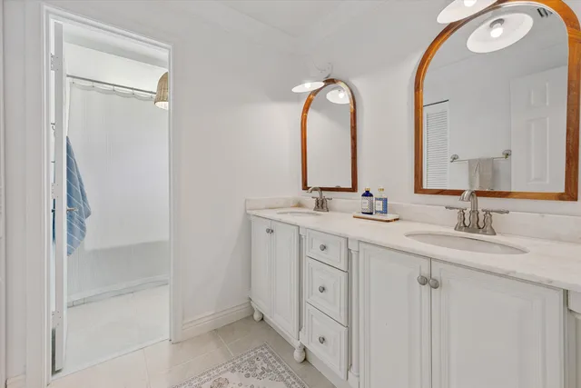 a roof deck with table and chairs and wooden floor