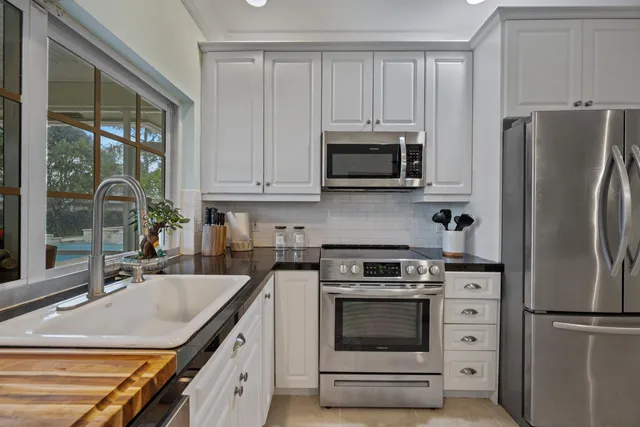 a view living room with granite countertop furniture and a flat screen tv