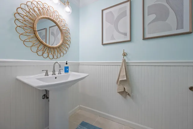 a bedroom with a large bed couch and a window