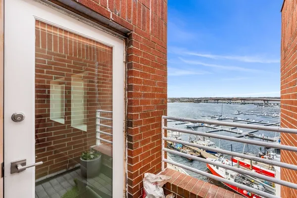 a view of a balcony with a floor to ceiling window
