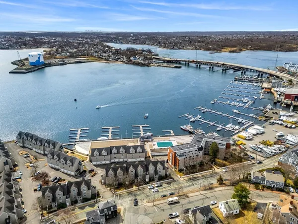 a view of a terrace with lawn chairs