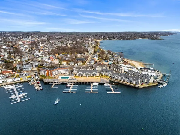 an aerial view of residential houses with outdoor space and seating