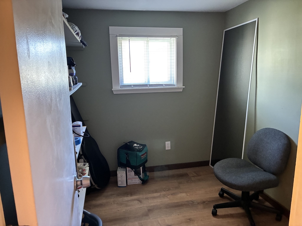 559 Tea Street, Unit 1 Charlemont, MA 01339 - Photo 7 of 14 a view of workspace room with wooden floor and windows