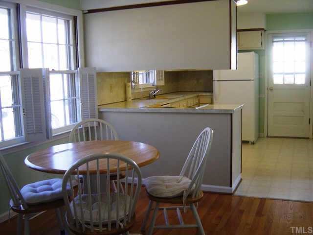 1906 Medfield Road Raleigh, NC 27607 - Photo 5 of 12 a view of a dining room with furniture and window