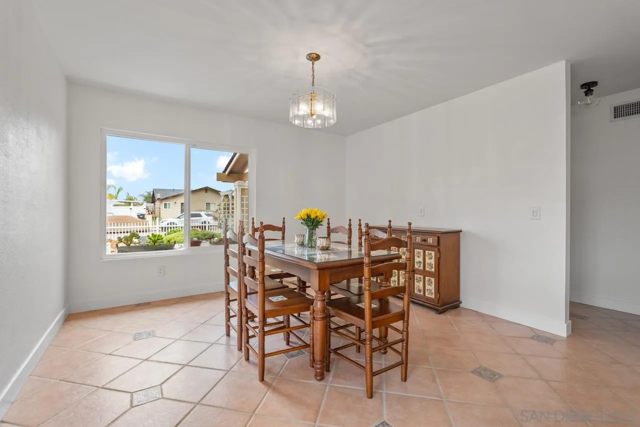 801 Ladysmith Drive El Cajon, CA 92020 - Photo 13 of 38 a view of a dining room with furniture and a chandelier