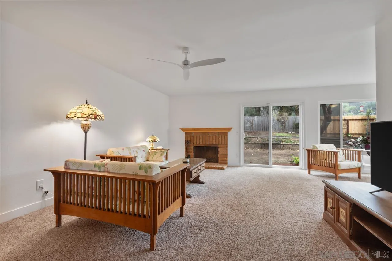 801 Ladysmith Drive El Cajon, CA 92020 - Photo 16 of 38 a bedroom with furniture and a fireplace