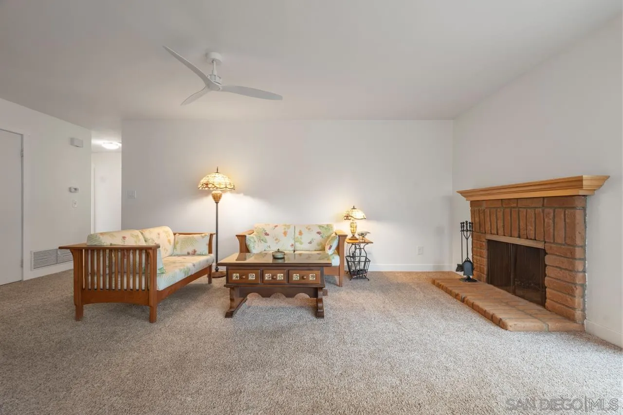 801 Ladysmith Drive El Cajon, CA 92020 - Photo 19 of 38 a living room with furniture and a fireplace