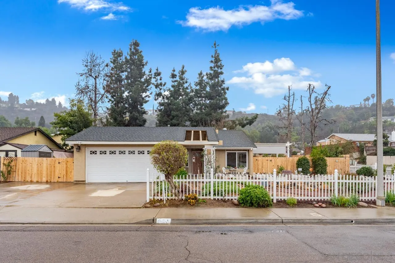 801 Ladysmith Drive El Cajon, CA 92020 - Photo 2 of 38 a front view of a house with a garden and mountain view