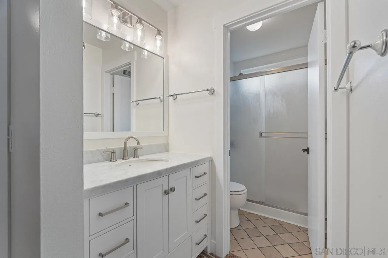 801 Ladysmith Drive El Cajon, CA 92020 - Photo 23 of 38 a view of bathroom with a sink mirror and toilet