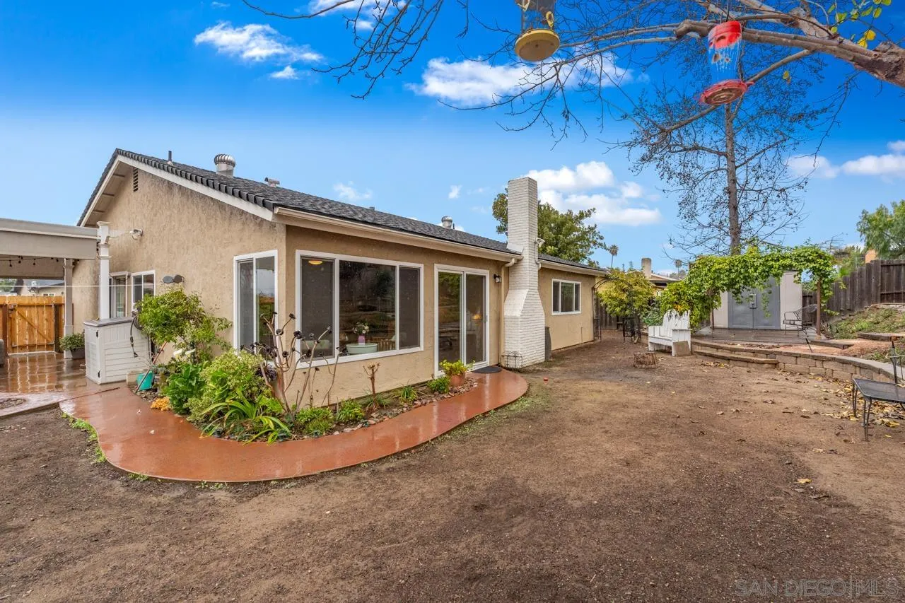 801 Ladysmith Drive El Cajon, CA 92020 - Photo 35 of 38 a view of a house with a small yard and potted plants