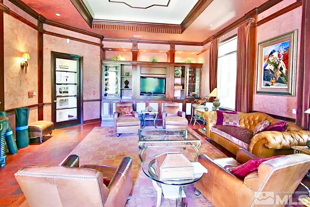 900 S Meadows, Unit 5122 Reno, NV 89521 - Photo 12 of 38 a living room with furniture fireplace and a large window