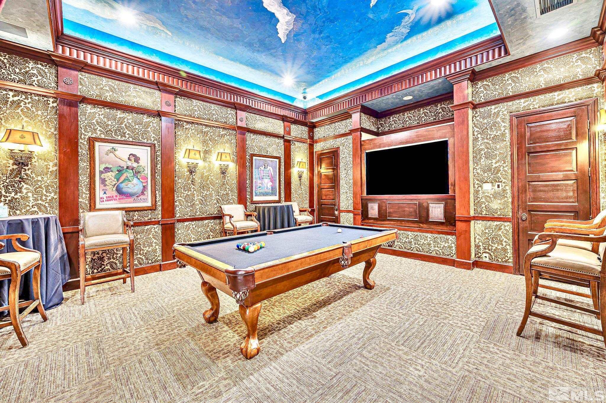 900 S Meadows, Unit 5122 Reno, NV 89521 - Photo 14 of 38 a living room with furniture a flat screen tv and a floor to ceiling window