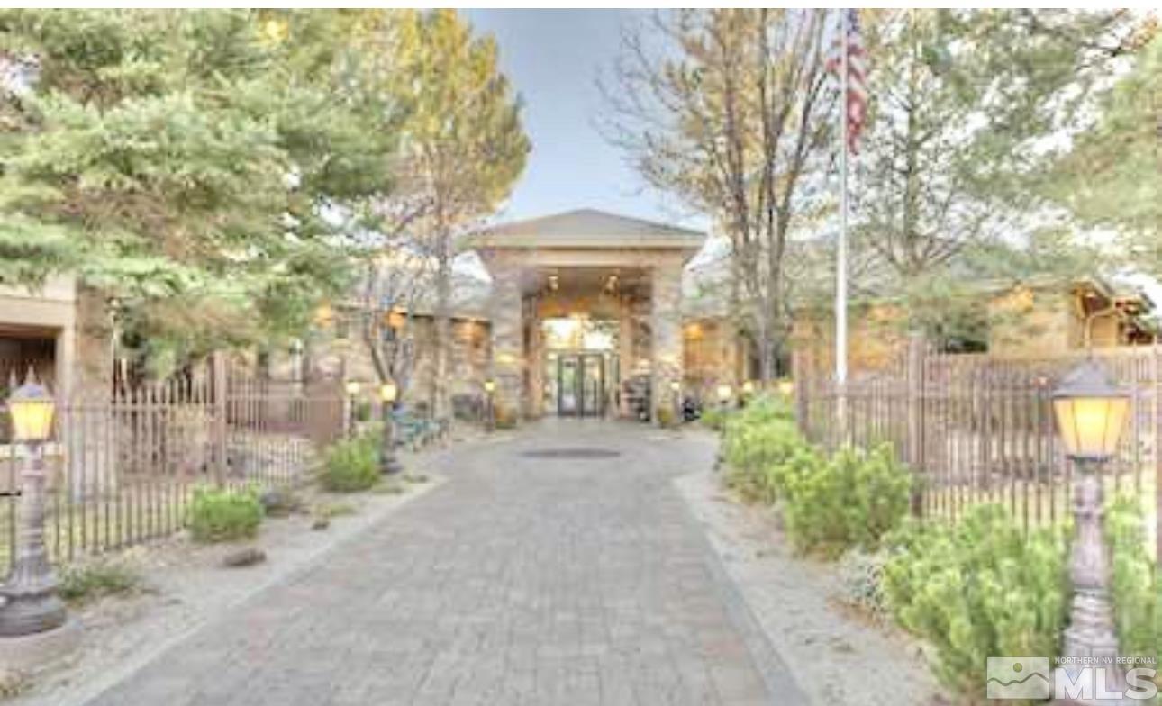 900 S Meadows, Unit 5122 Reno, NV 89521 - Photo 15 of 38 a front view of a house with a yard and potted plants