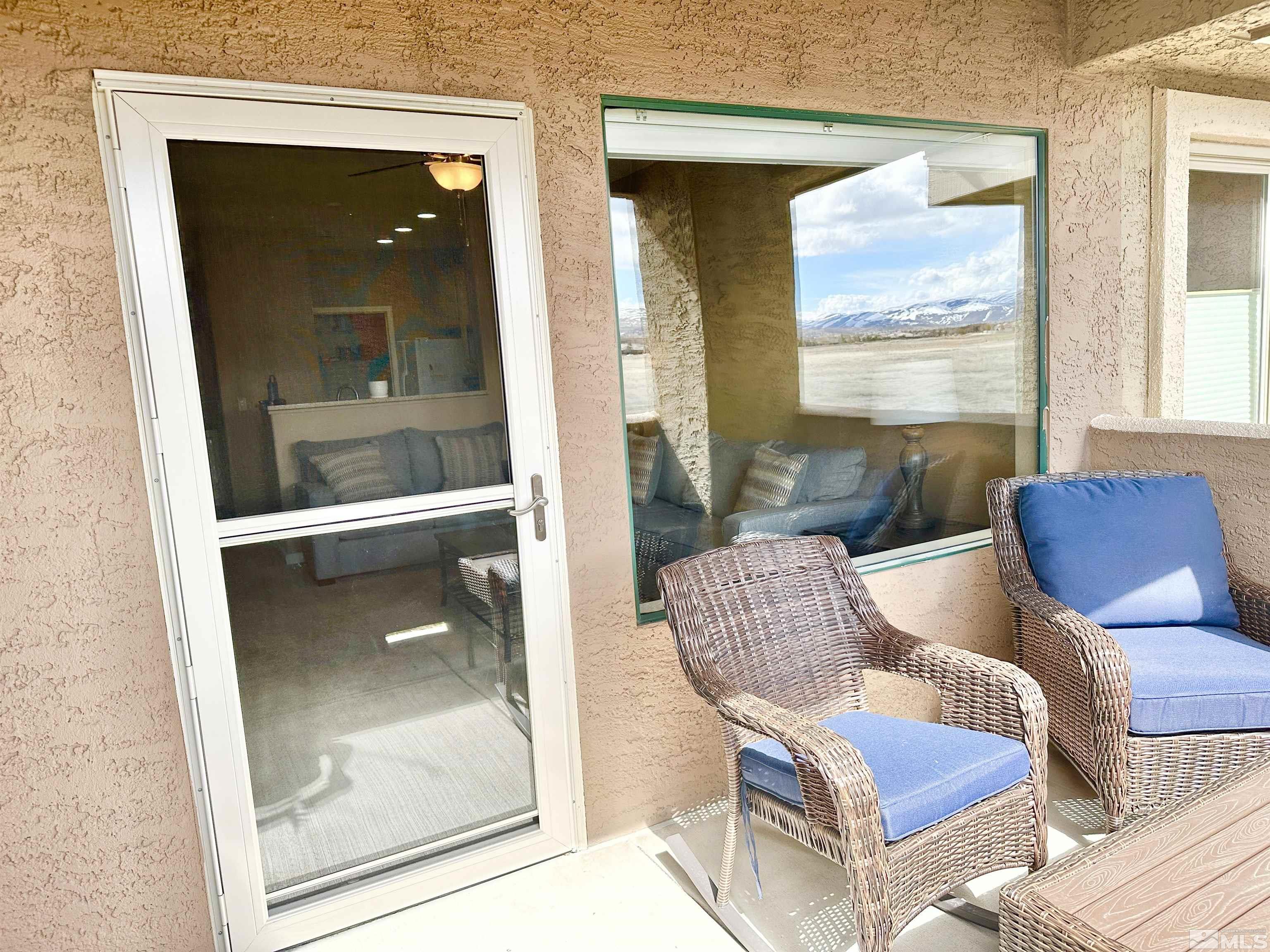 900 S Meadows, Unit 5122 Reno, NV 89521 - Photo 19 of 38 a living room with furniture and a window