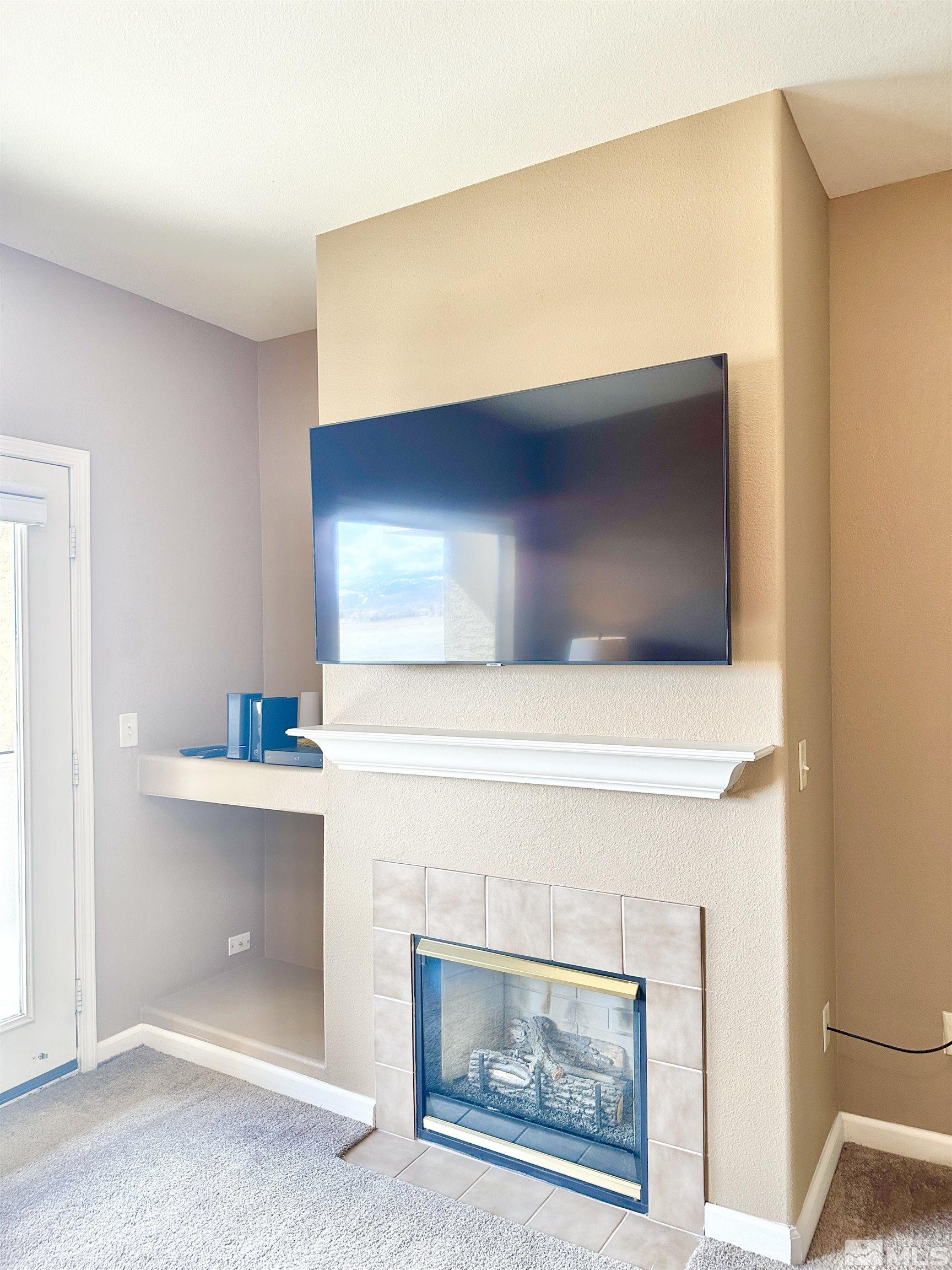 900 S Meadows, Unit 5122 Reno, NV 89521 - Photo 25 of 38 a living room with a fireplace