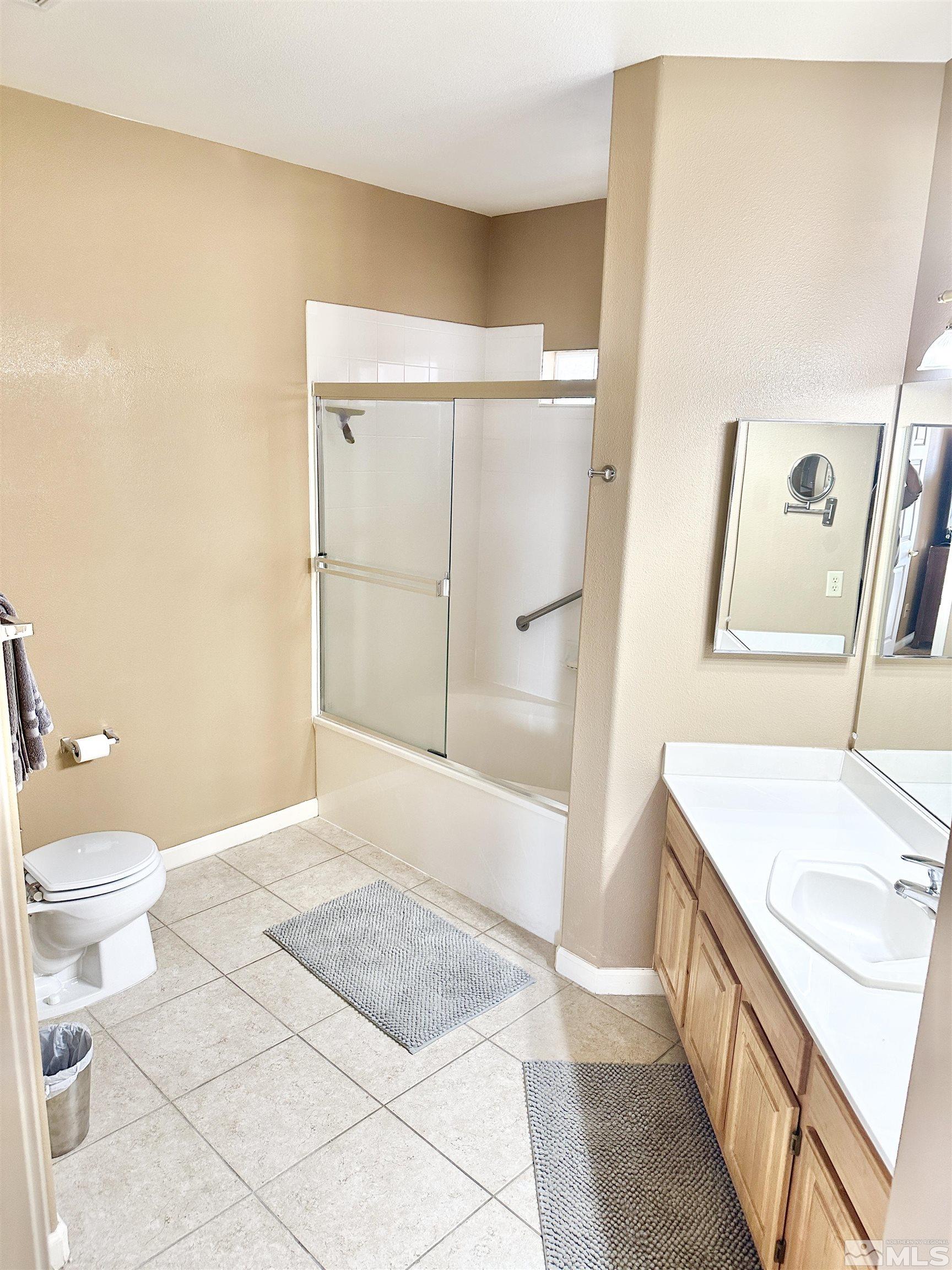 900 S Meadows, Unit 5122 Reno, NV 89521 - Photo 27 of 38 a bathroom with a sink a toilet and shower