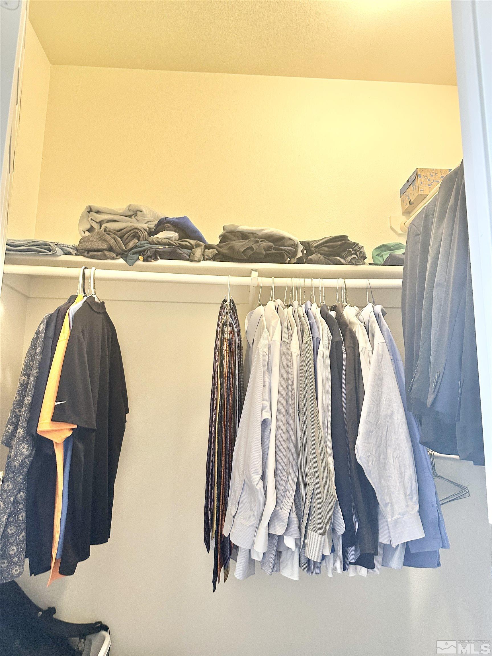 900 S Meadows, Unit 5122 Reno, NV 89521 - Photo 28 of 38 a view of walk in closet with clothes